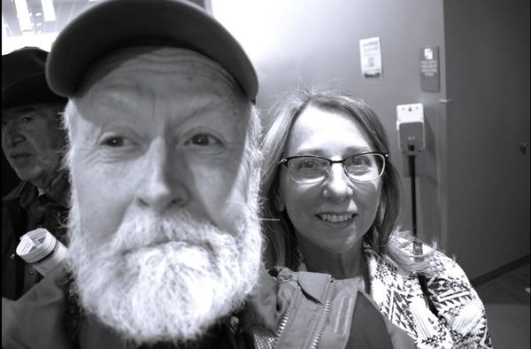 Black and white selfie of a bearded man and a smiling woman