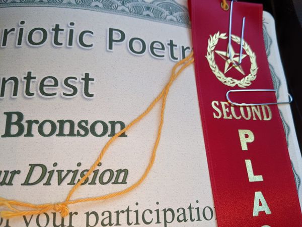 Second place ribbon on a patriotic poetry contest certificate